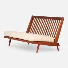 Cushion settee by George Nakashima, American black walnut, upholstery, sold Feb 2025