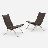 PK 22 chairs, pair by Poul Kjærholm, stainless steel, leather upholstery, sold Feb 2025