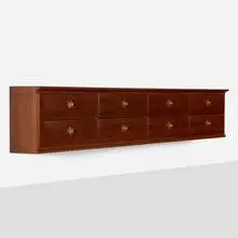 Wall-mounted cabinet by Osvaldo Borsani, c. 1945, mahogany, brass, sold Feb 2025