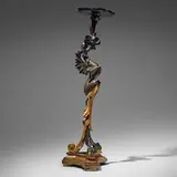 Rococo Style, Winged griffin torchère, parcel gilt and ebonized plaster and wood
