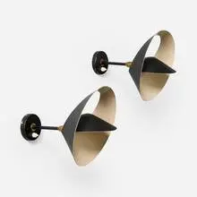 Saturne sconces, pair by Serge Mouille, 1957, enameled aluminum and steel, brass, sold Feb 2025