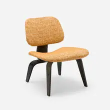 LCW-1 by Charles and Ray Eames, 1945 / 1949, aniline-dyed ash plywood, wool upholstery, sold Feb 2025