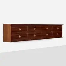 Wall-mounted cabinet by Osvaldo Borsani, c. 1945, mahogany, brass, sold Feb 2025