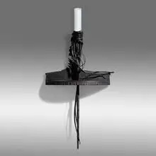 Wall Torchère by Albert Paley, 1992, forged and fabricated steel with a blackened finish, slate, sold May 2021