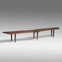 Bench by Phillip Lloyd Powell, c. 1960, American black walnut, sold May 2021
