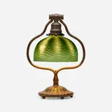 Damascene desk lamp by Tiffany Studios, c. 1910, patinated bronze, Favrile glass, sold May 2021