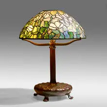 Tulip table lamp by Tiffany Studios, c. 1910, leaded glass, patinated bronze, sold May 2021