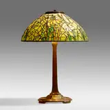 Daffodil table lamp by Tiffany Studios, 1899-1920, patinated bronze, leaded glass, sold May 2021