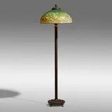 Vine Border floor lamp by Tiffany Studios, c. 1910, leaded glass, patinated bronze, sold May 2021