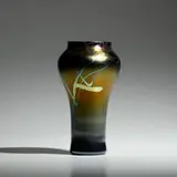 Vase with leaves and vines by Tiffany Studios, c. 1896, hand-blown Favrile glass, sold May 2021