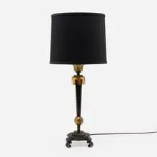 Table lamp by Gilbert Poillerat, c. 1940, patinated and gilt iron, sold Jan 2025