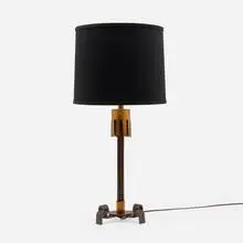 Table lamp by Gilbert Poillerat, c. 1940, patinated and gilt iron, sold Jan 2025