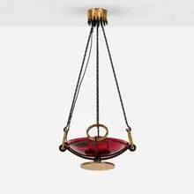 Plafonnier by Gilbert Poillerat, c. 1950, patinated and gilt wrought iron, glass, sold Jan 2025