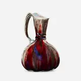Pitcher by Léon Kann for Manufacture Nationale de Sèvres, 1898, oxblood glazed porcelain, sold May 2021