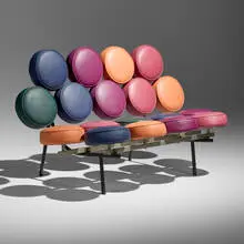Sofa by George Nelson & Associates, c. 2000, enameled steel, aluminum, vinyl, brushed steel, sold Jan 2025
