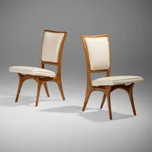 Dining chairs model 175A, pair by Vladimir Kagan, c. 1950 / 1954, walnut, vinyl, patinated steel tacks, sold Jan 2025