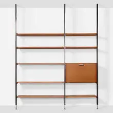 CSS (Comprehensive Storage System) by George Nelson & Associates, 1959, walnut, enameled and brushed aluminum, laminate, lacquered board, glazed ceramic, sold Jan 2025
