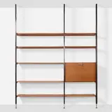 CSS (Comprehensive Storage System) by George Nelson & Associates, 1959, walnut, enameled and brushed aluminum, laminate, lacquered board, glazed ceramic, sold Jan 2025