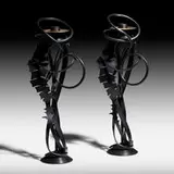 Albert Paley, Double Shear Candleholders, pair, 2014, forged mild steel with a blackened patina, removable brass bobeches (collars)