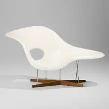 La Chaise by Charles and Ray Eames, lacquered fiberglass, chrome-plated steel, oak, sold Dec 2024