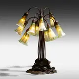 Twelve-light Lily table lamp by Tiffany Studios, 1899-1920, patinated bronze, Favrile glass, sold Jan 2021