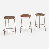 Stools from the College of Architecture, Chandigarh, set of three by Pierre Jeanneret, c. 1960, teak, painted steel, sold Dec 2024
