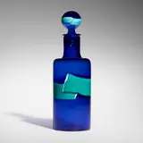 A Fasce Orizzontali bottle with stopper by Fulvio Bianconi, c. 1951, glass with polychrome bands, sold Dec 2024