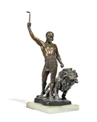 Jean Verschneider, patinated bronze figural group of a lion tamer with lion, patinated bronze