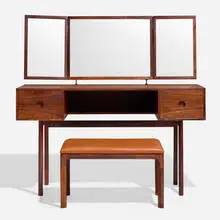 Vanity and stool by Kai Kristiansen, c. 1965, rosewood, mirrored glass, chrome-plated steel, leather upholstery, sold Nov 2024