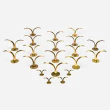 Lily candlesticks, collection of twenty by Ivar Ålenius-Björk, brass, sold Nov 2024