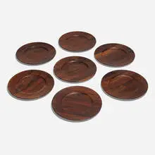 Plates, set of fourteen by Jens Quistgaard, c. 1965, rosewood, sold Nov 2024