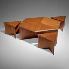 Table, model 453-C and stools model 452-A, set of three by Frank Lloyd Wright, 1955, mahogany, sold Oct 2024