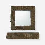 Custom Sculpted Bronze console and mirror by Paul Evans, 1972, bronzed resin over wood, slate, mirrored glass, sold May 2020