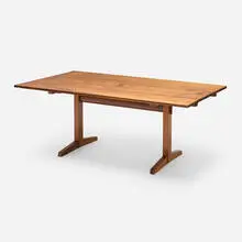 Trestle dining table by George Nakashima, 1967, American black walnut, rosewood, sold Oct 2024