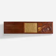 wall-mounted cabinet by Phillip Lloyd Powell, c. 1970, carved and sculpted walnut, gold leaf, sold May 2020