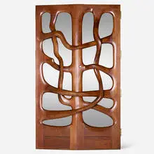 Wendell Castle, Custom doors for Gannett Co., Inc., Rochester, 1976, carved and sculpted walnut, zebrawood, smoked mirrored glass, brass