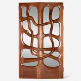 Custom doors for Gannett Co., Inc., Rochester by Wendell Castle, 1976, carved and sculpted walnut, zebrawood, smoked mirrored glass, brass, sold May 2020