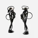 Albert Paley, Double Shear Candleholders, pair, 2014, forged mild steel with a blackened patina, removable brass bobeches (collars)