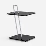 Eileen Gray, Occasional table, chrome-plated steel, lacquered wood