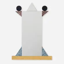 Diva mirror by Ettore Sottsass, 1984, laminate over wood, lacquered wood, mirrored glass, olive burl, sold Sep 2024