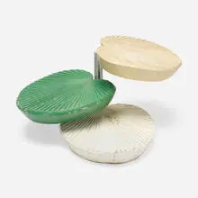 Rotating tiered occasional table by Modern, c. 1975, lacquered wood, matte chrome-plated steel and brass, sold Aug 2024