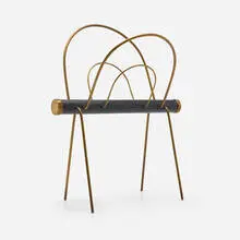 Magazine rack by Carl Auböck, c. 1960, brass, leather, sold Aug 2024