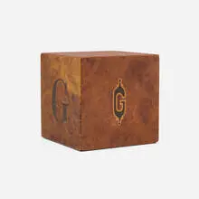 Monogram paperweight by Andrew Szoeke, c. 1940, burl veneer, marquetry, sold Aug 2024