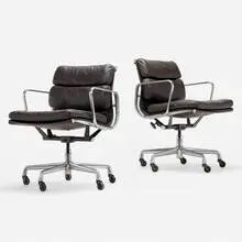 Soft Pad Management chairs, pair by Charles and Ray Eames, 1958 / 1997, leather, aluminum, enameled steel, sold Aug 2024