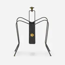 attribution Jacques Adnet, Magazine rack, c. 1950, iron, brass