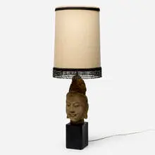 Buddha table lamp by attribution James Mont, c. 1960, painted plaster, brass, fabric shade with plastic beads, sold Aug 2024