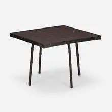 attribution Jacques Adnet, Coffee table, c. 1955, saddle-stitched leather over steel, glazed stoneware, wood, brass