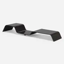 Low table by Oscar Niemeyer, c. 1980, lacquered wood, rubber, sold Jun 2024