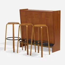 Bar and stools, set of three by Johannes Andersen, c. 1965, teak, enameled steel, mirrored glass, clear and black glass, laminate, brass, sold May 2024
