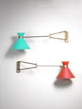 René Mathieu, A Pair of Wall Lamps, circa 1955, enamelled and pierced metal shades